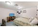 Basement bedroom with TV and ample storage at 6450 Trade Ct, Spring Hill, FL 34606
