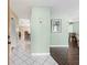 Open concept hallway showcasing beautiful tile and wood-look flooring, offering a welcoming feel at 6450 Trade Ct, Spring Hill, FL 34606