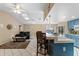Open living room and bar with access to the outdoor pool provides an ideal layout for entertaining at 6450 Trade Ct, Spring Hill, FL 34606