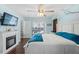 Spacious main bedroom features an electric fireplace and access to an outdoor pool area at 6450 Trade Ct, Spring Hill, FL 34606