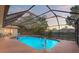 The enclosed pool is perfect for outdoor living with a screen and plenty of space at 6450 Trade Ct, Spring Hill, FL 34606