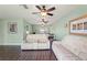 Open living room with dark tile flooring and ceiling fans at 6450 Trade Ct, Spring Hill, FL 34606