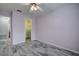 Bedroom with ceiling fan, closet, and tile floors at 7499 Heather Walk, Weeki Wachee, FL 34613