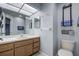 Well-lit bathroom, wood vanity, and tiled flooring at 7499 Heather Walk, Weeki Wachee, FL 34613