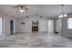 Spacious living room with vaulted ceilings, tile floors, and a wet bar at 7499 Heather Walk, Weeki Wachee, FL 34613