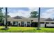 Charming single-story home featuring a well-manicured lawn and neutral color palette at 7499 Heather Walk, Weeki Wachee, FL 34613