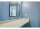 Vanity area with mirror and additional counter space at 7499 Heather Walk, Weeki Wachee, FL 34613