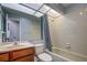 Updated bathroom with shower/tub combo, vanity, and wood cabinet at 7499 Heather Walk, Weeki Wachee, FL 34613