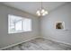 Simple dining area with tile flooring and a large window with blinds at 7499 Heather Walk, Weeki Wachee, FL 34613