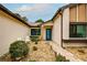 Inviting front entrance with landscaped walkway and seating area at 7499 Heather Walk, Weeki Wachee, FL 34613