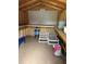 Organized storage shed with pegboard and shelving at 8353 Forest Oaks Blvd, Spring Hill, FL 34606