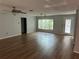 Spacious living room featuring hardwood floors and large windows at 8353 Forest Oaks Blvd, Spring Hill, FL 34606