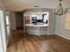 Modern kitchen with stainless steel appliances and an island at 8353 Forest Oaks Blvd, Spring Hill, FL 34606