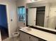 Bathroom with toilet and sink vanity at 8353 Forest Oaks Blvd, Spring Hill, FL 34606