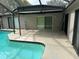 Spacious pool and patio with sliding glass doors to house at 8353 Forest Oaks Blvd, Spring Hill, FL 34606