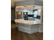 Modern kitchen with stainless steel appliances and an island at 8353 Forest Oaks Blvd, Spring Hill, FL 34606