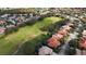 Beautiful aerial view of a neighborhood showcasing tree-lined streets, manicured lawns, and lush greenery in a well-maintained community at 10441 Garda Dr, Trinity, FL 34655