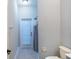 Bathroom with shower and door to the exterior at 10441 Garda Dr, Trinity, FL 34655