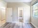 Bedroom featuring new floors, walk-in closet and natural light at 10441 Garda Dr, Trinity, FL 34655