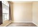 Neutral bedroom featuring new floors, large window, and natural light at 10441 Garda Dr, Trinity, FL 34655