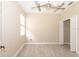 Bright bedroom with new floors, ceiling fan, closet, and natural light at 10441 Garda Dr, Trinity, FL 34655
