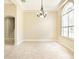 Bright dining area with tile flooring, a modern chandelier, and large window at 10441 Garda Dr, Trinity, FL 34655