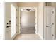Inviting foyer with decorative glass front door and views of living spaces at 10441 Garda Dr, Trinity, FL 34655