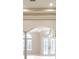 Elegant foyer with high ceilings, decorative columns, and a view of the front door at 10441 Garda Dr, Trinity, FL 34655