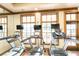 Modern gym featuring multiple treadmills and other exercise equipment with windows at 10441 Garda Dr, Trinity, FL 34655