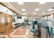 Well-lit gym with treadmills, weights and exercise machines for a complete workout at 10441 Garda Dr, Trinity, FL 34655