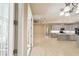 Open-concept kitchen with stainless steel appliances connects seamlessly to the living area at 10441 Garda Dr, Trinity, FL 34655