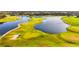 Aerial view of a beautiful golf course with water features at 10441 Garda Dr, Trinity, FL 34655