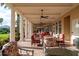 Inviting outdoor patio with ceiling fans, comfortable seating, and views of manicured lawns at 10441 Garda Dr, Trinity, FL 34655