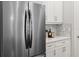 Stainless steel refrigerator in a contemporary kitchen setting at 10693 Calluna Dr, Odessa, FL 33556