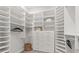 Large walk-in closet with ample shelving and hanging space at 10693 Calluna Dr, Odessa, FL 33556
