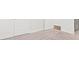 Bedroom with carpet, white doors, and wood-look flooring at 10693 Calluna Dr, Odessa, FL 33556