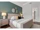 Main bedroom with an accent wall and ample natural light at 10693 Calluna Dr, Odessa, FL 33556
