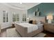 Spacious main bedroom with a neutral color palette and large windows at 10693 Calluna Dr, Odessa, FL 33556