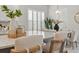 Kitchen island with seating and white quartz countertops at 10693 Calluna Dr, Odessa, FL 33556