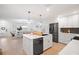 Open concept kitchen with island, stainless steel appliances, and ample counter space at 203 S Spring Blvd, Tarpon Springs, FL 34689