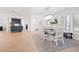 Light-filled dining room featuring hardwood floors and a charming table at 203 S Spring Blvd, Tarpon Springs, FL 34689