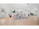 Bright dining room with hardwood floors and a large table at 203 S Spring Blvd, Tarpon Springs, FL 34689