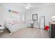 Charming bedroom with twin bed, dresser, and window seat at 203 S Spring Blvd, Tarpon Springs, FL 34689