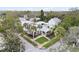 Charming house with palm trees and a lush green lawn at 203 S Spring Blvd, Tarpon Springs, FL 34689