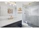 Stylish bathroom with a black and white patterned shower at 203 S Spring Blvd, Tarpon Springs, FL 34689
