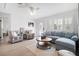 Bright living room with comfy sectional sofa and coffee table at 203 S Spring Blvd, Tarpon Springs, FL 34689