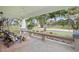 Inviting front porch with seating area, perfect for relaxing and enjoying the view at 203 S Spring Blvd, Tarpon Springs, FL 34689
