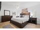 Spacious Primary bedroom with a king-size bed and dresser at 203 S Spring Blvd, Tarpon Springs, FL 34689