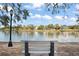Park bench with a view of the river and homes at 203 S Spring Blvd, Tarpon Springs, FL 34689