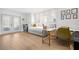 Bright home office with a daybed, desk, and French doors at 203 S Spring Blvd, Tarpon Springs, FL 34689